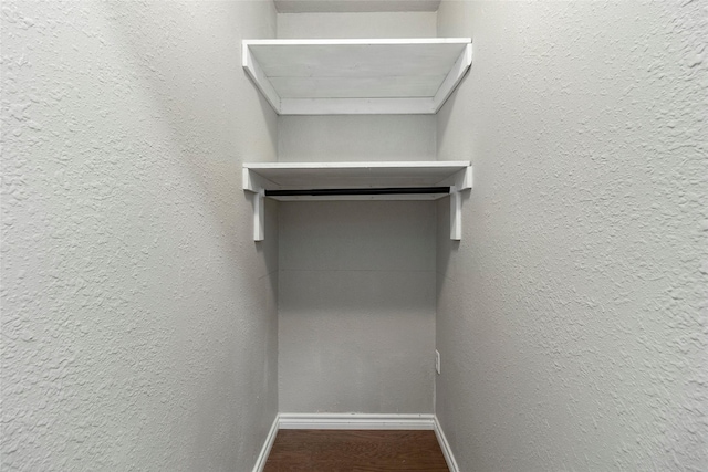 spacious closet featuring hardwood / wood-style floors