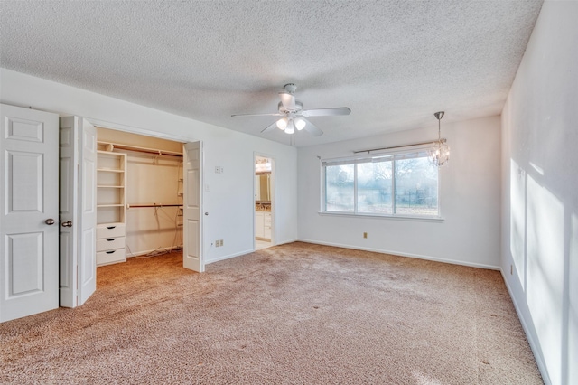 unfurnished bedroom featuring a textured ceiling, ceiling fan, light carpet, and a closet