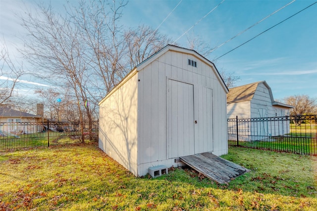 view of outbuilding with a lawn