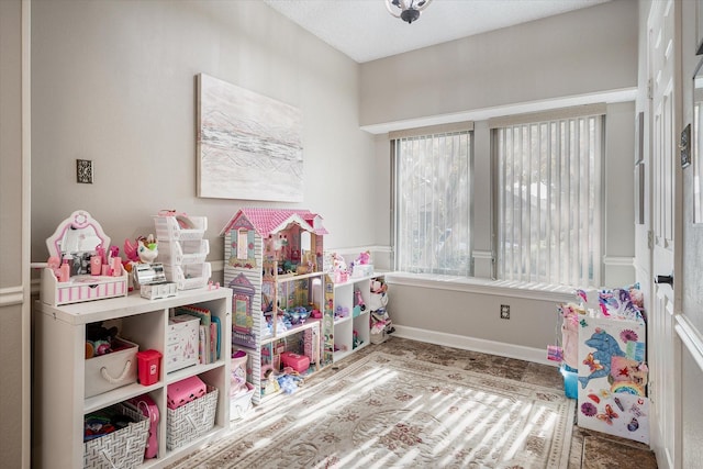 recreation room featuring plenty of natural light