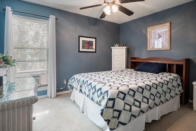 carpeted bedroom featuring ceiling fan, cooling unit, and a textured ceiling