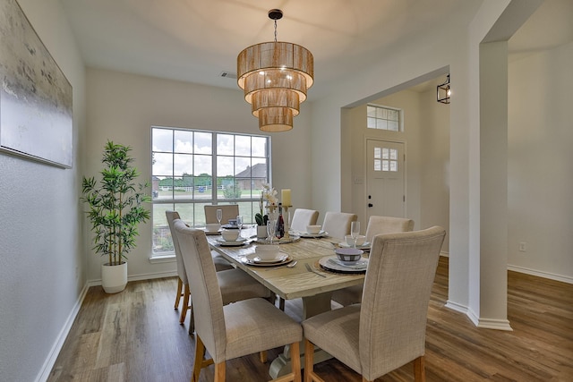 dining room with wood-type flooring