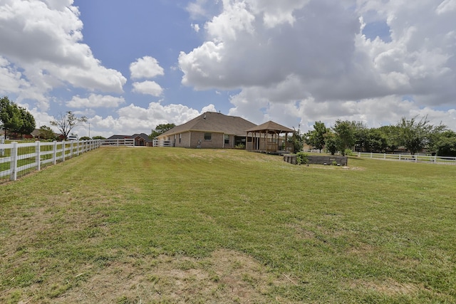 view of yard with a gazebo and a rural view