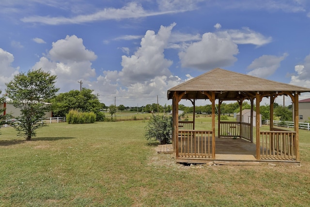 view of yard featuring a gazebo and a storage unit