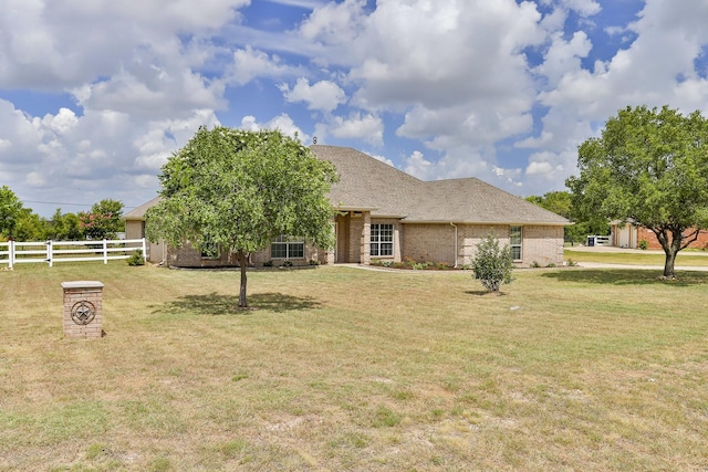 single story home featuring a front yard