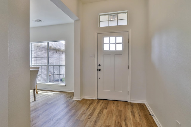 foyer entrance with light hardwood / wood-style flooring