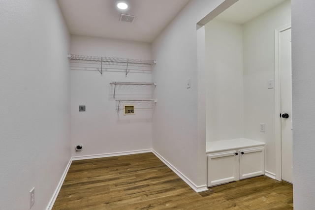 laundry room featuring hookup for an electric dryer, dark hardwood / wood-style floors, and washer hookup