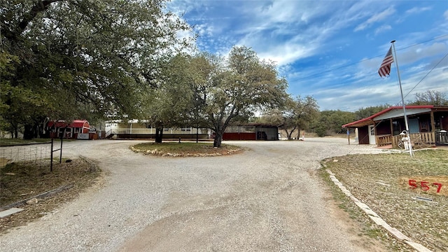 view of road featuring dirt driveway