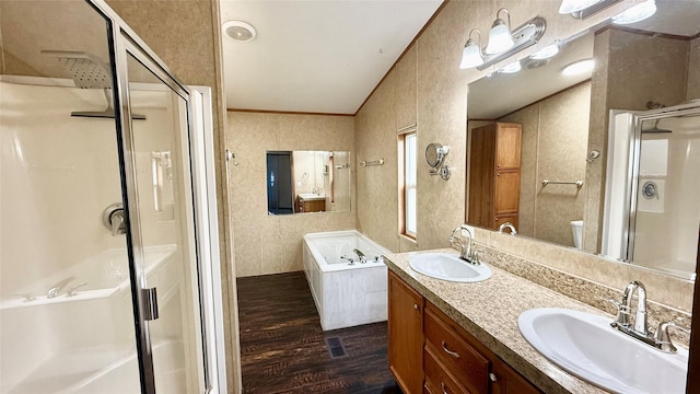 bathroom featuring a shower stall, wood finished floors, crown molding, and a sink