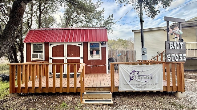 view of shed featuring fence