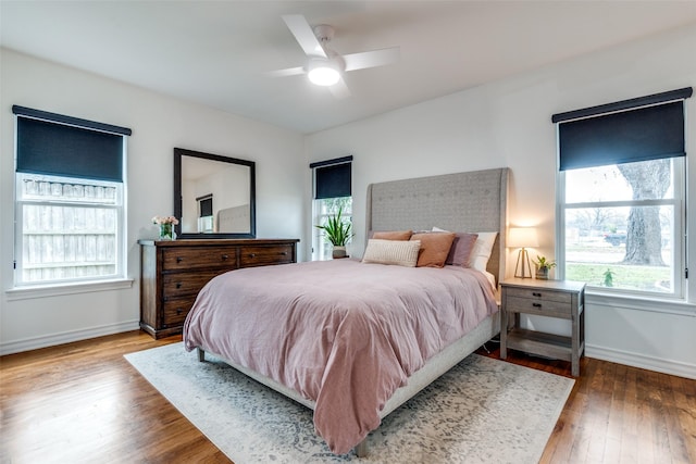 bedroom featuring hardwood / wood-style floors and ceiling fan