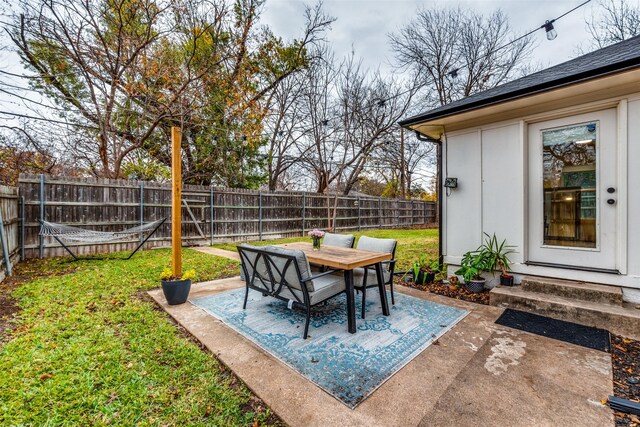 back of property featuring a yard and a patio area