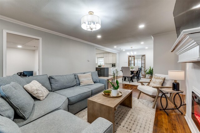 dining room featuring dark hardwood / wood-style flooring, an inviting chandelier, and crown molding