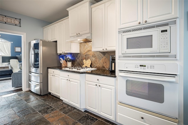 kitchen featuring backsplash, stainless steel appliances, and white cabinetry