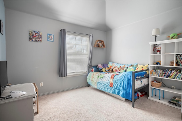 bedroom featuring carpet flooring and lofted ceiling