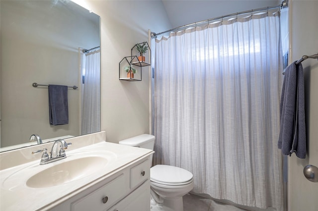 bathroom with tile patterned flooring, vanity, vaulted ceiling, and toilet