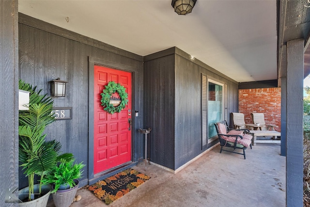 doorway to property with a porch