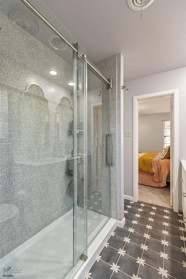 bathroom featuring a shower with door