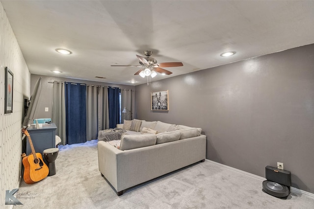 living room with ceiling fan and carpet