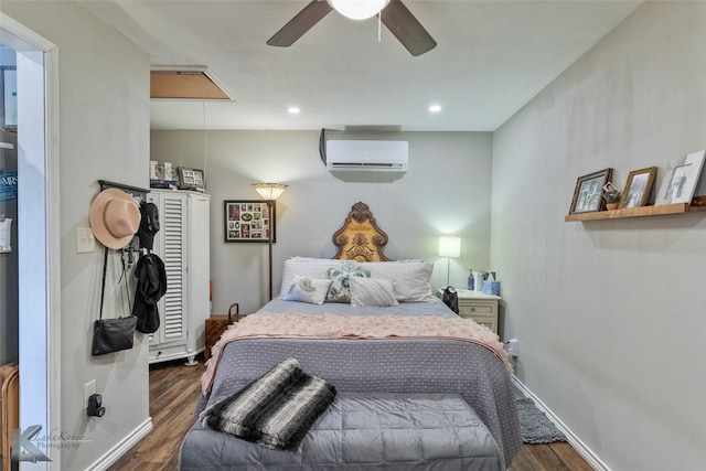 bedroom with ceiling fan, dark hardwood / wood-style flooring, and a wall unit AC