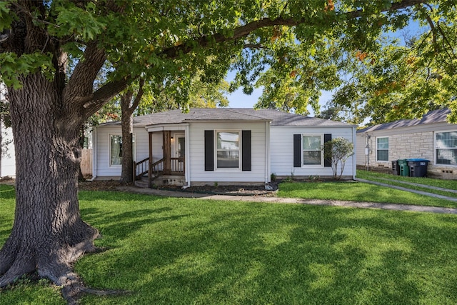 ranch-style home with a front lawn