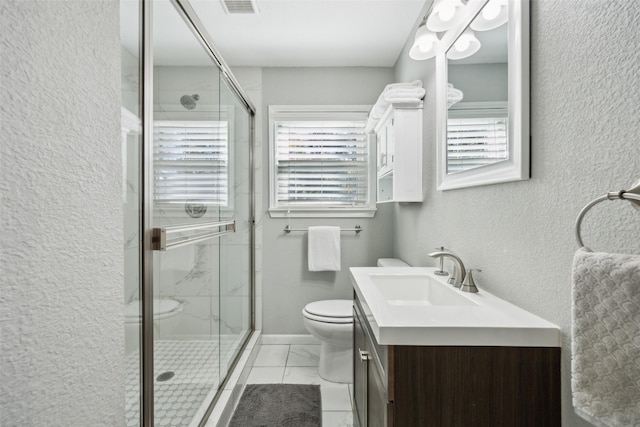 bathroom featuring walk in shower, vanity, and toilet