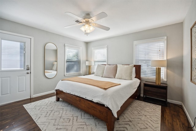 bedroom with ceiling fan and dark hardwood / wood-style flooring