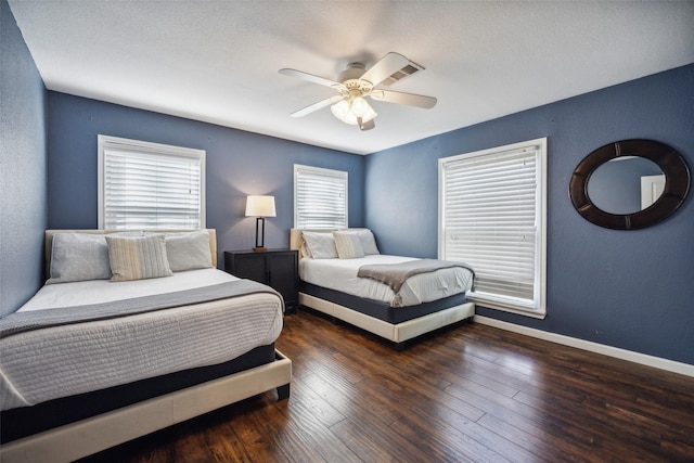 bedroom featuring dark wood-type flooring and ceiling fan