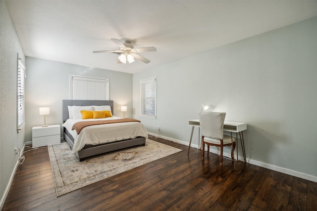 bedroom with dark wood-type flooring and ceiling fan