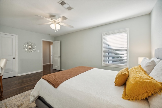 bedroom featuring dark wood-type flooring and ceiling fan