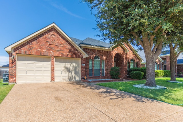 view of property with a front yard and a garage