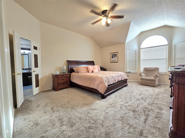 carpeted bedroom featuring a textured ceiling, ceiling fan, and vaulted ceiling