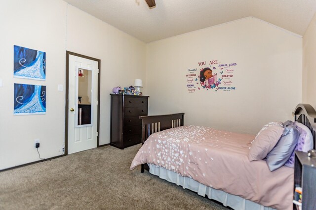 bedroom with vaulted ceiling and carpet floors