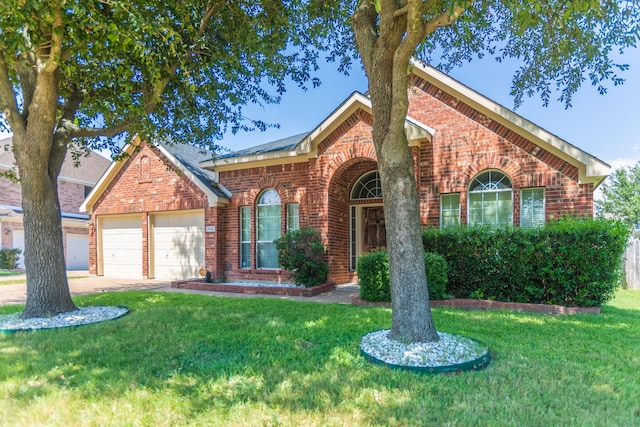 view of front property with a garage and a front lawn