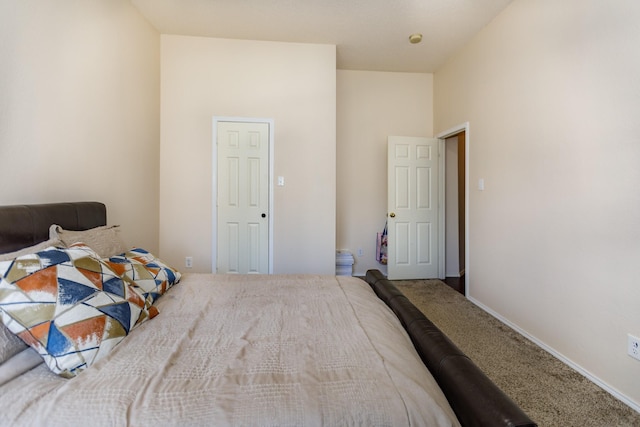 bedroom with carpet flooring and a high ceiling