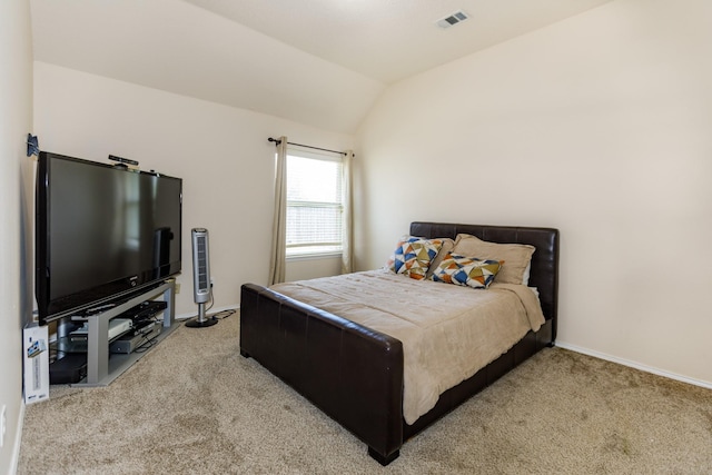 bedroom with carpet and vaulted ceiling