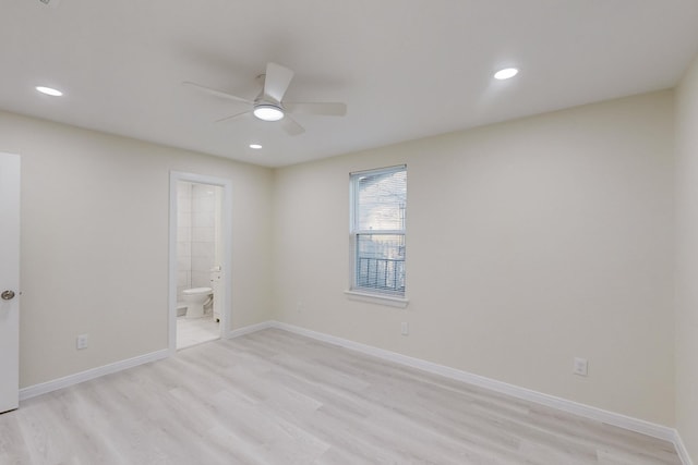 spare room featuring ceiling fan and light hardwood / wood-style flooring