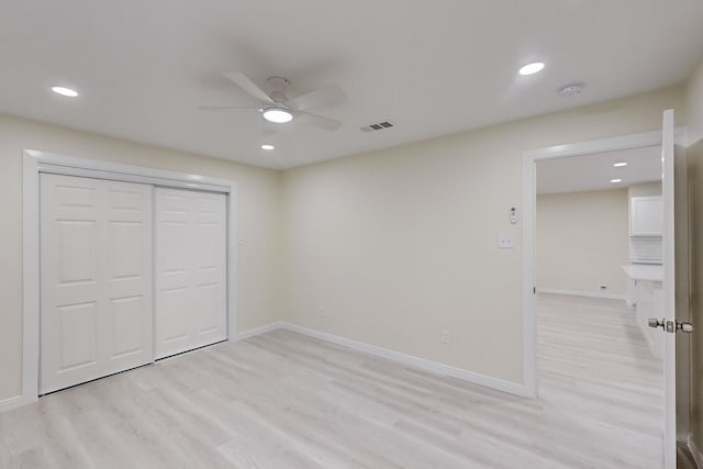 unfurnished bedroom featuring a closet, ceiling fan, and light hardwood / wood-style floors