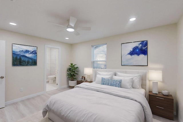 bedroom with connected bathroom, light hardwood / wood-style floors, and ceiling fan