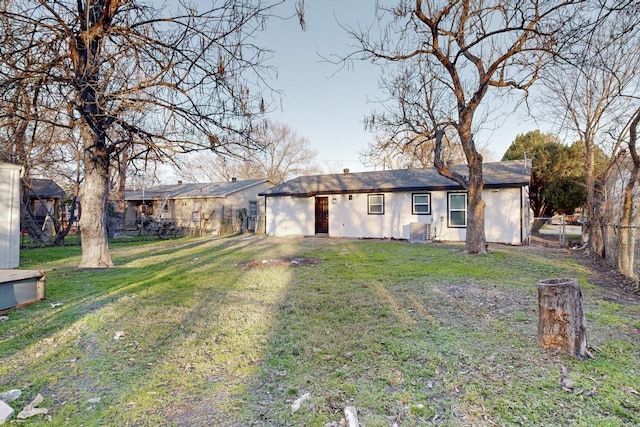 exterior space with a yard and central air condition unit