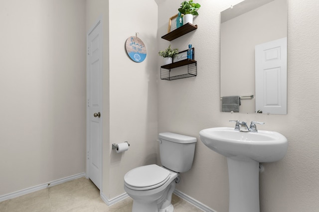 bathroom featuring sink and toilet