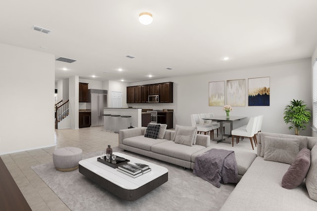 living room with light tile patterned floors