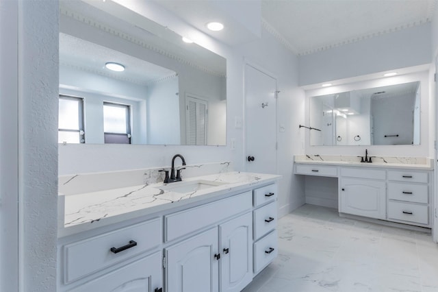 bathroom featuring vanity and crown molding