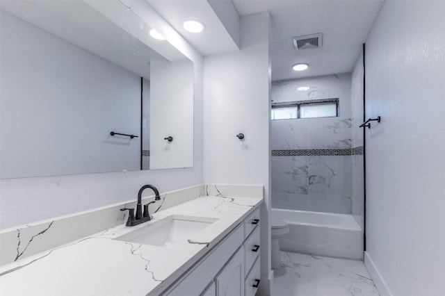 full bathroom featuring vanity, toilet, and tiled shower / bath combo