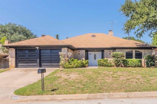 ranch-style home with a garage and a front yard