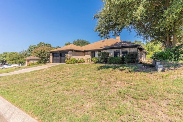 single story home featuring a garage and a front lawn