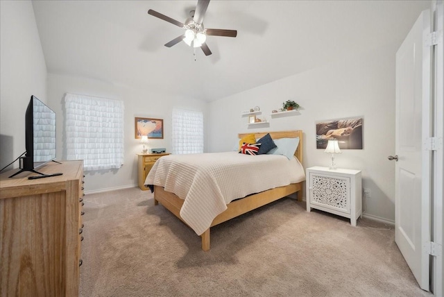 bedroom with ceiling fan and light carpet