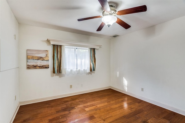 empty room featuring ceiling fan and hardwood / wood-style flooring