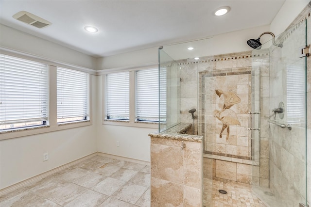 bathroom featuring a shower with shower door