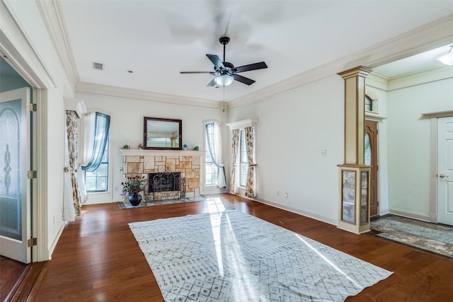 living room featuring dark wood-type flooring, plenty of natural light, ceiling fan, and ornamental molding